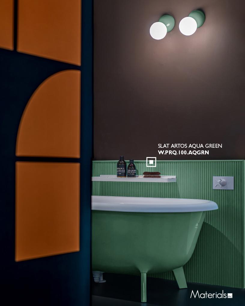 Slat Artos Aqua Green fluted wall panel installed behind a green clawfoot bathtub