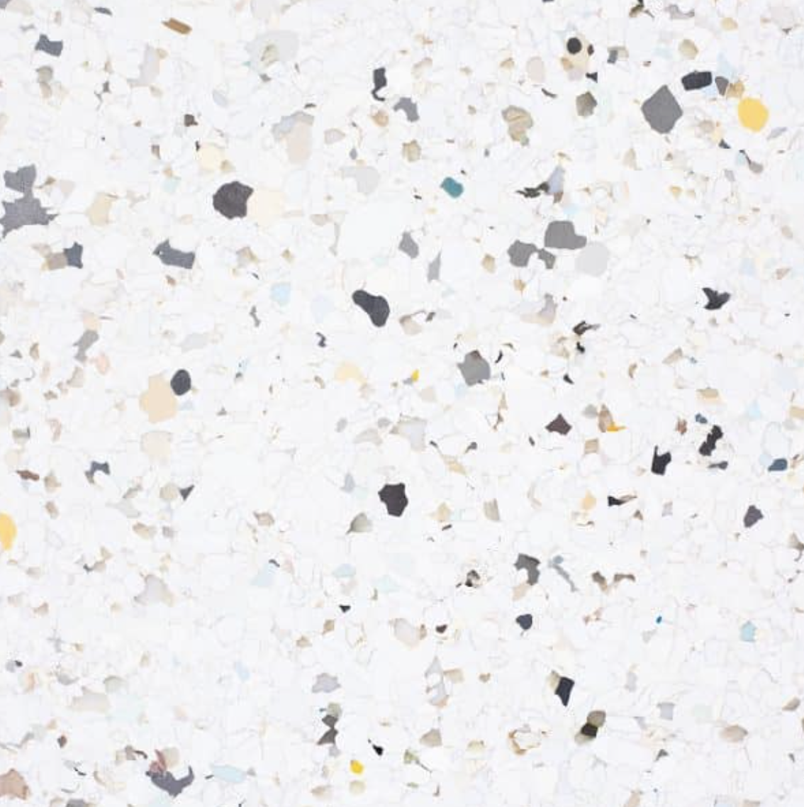 Eco-Flakes Butter Pecan real material sample - recycled composite panel with scattered flakes