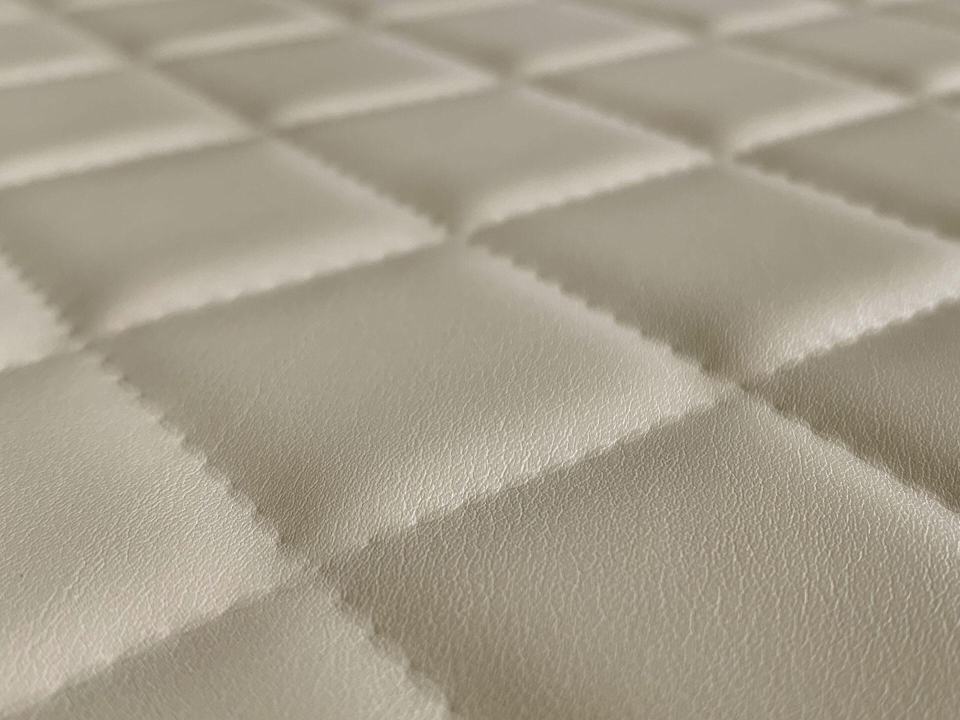 Elements Textile – Cream Cube Leather real material sample - close-up - cream leather quilted in a stitched diamond grid