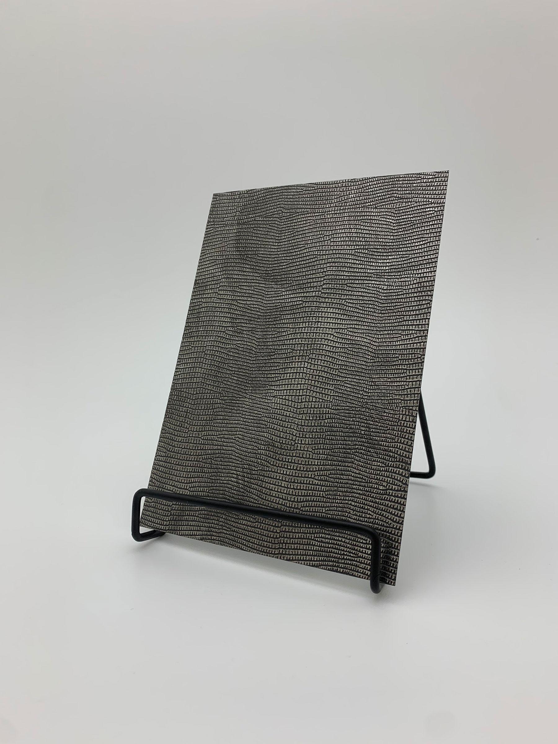 Elements Dark Luxe Leather real material sample - a fine reptile-scale leather grain in charcoal