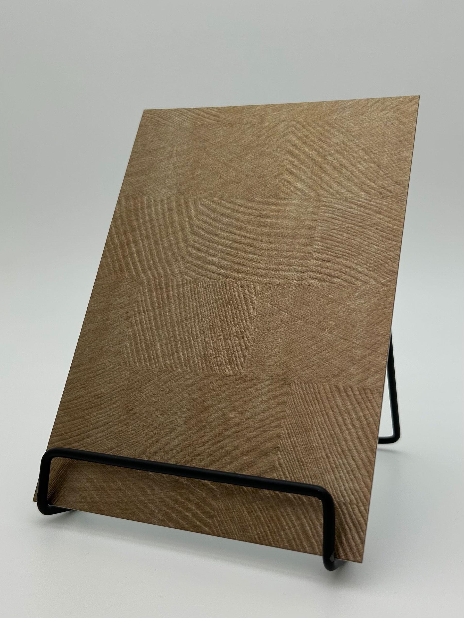 Elements Textile Drift Antique Gold real material sample - antique-gold panel with sweeping wood-grain-like swirls