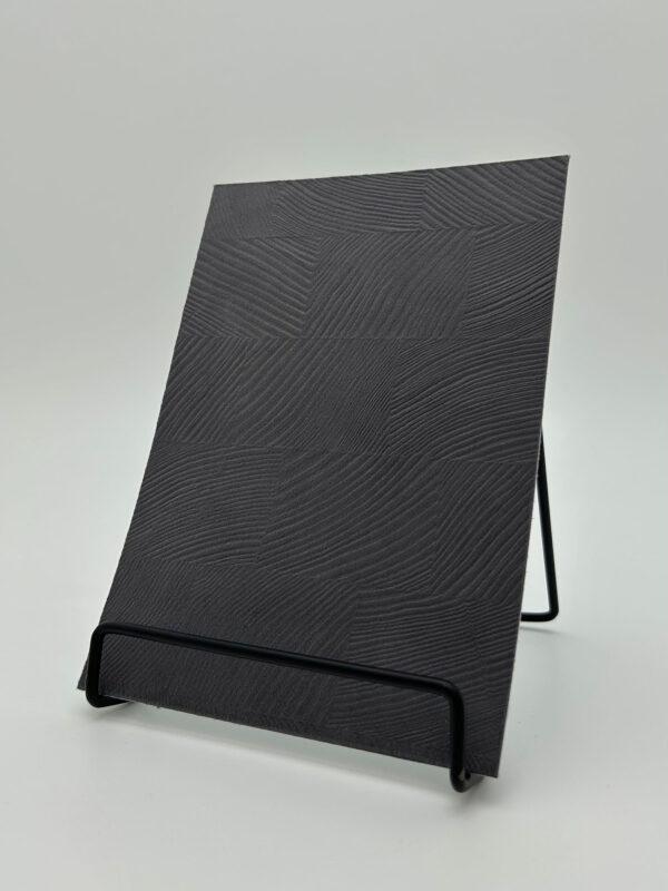 Elements Textile Drift Ash Velvet real material sample - charcoal velvet-touch panel with sweeping wood-grain-like swirls