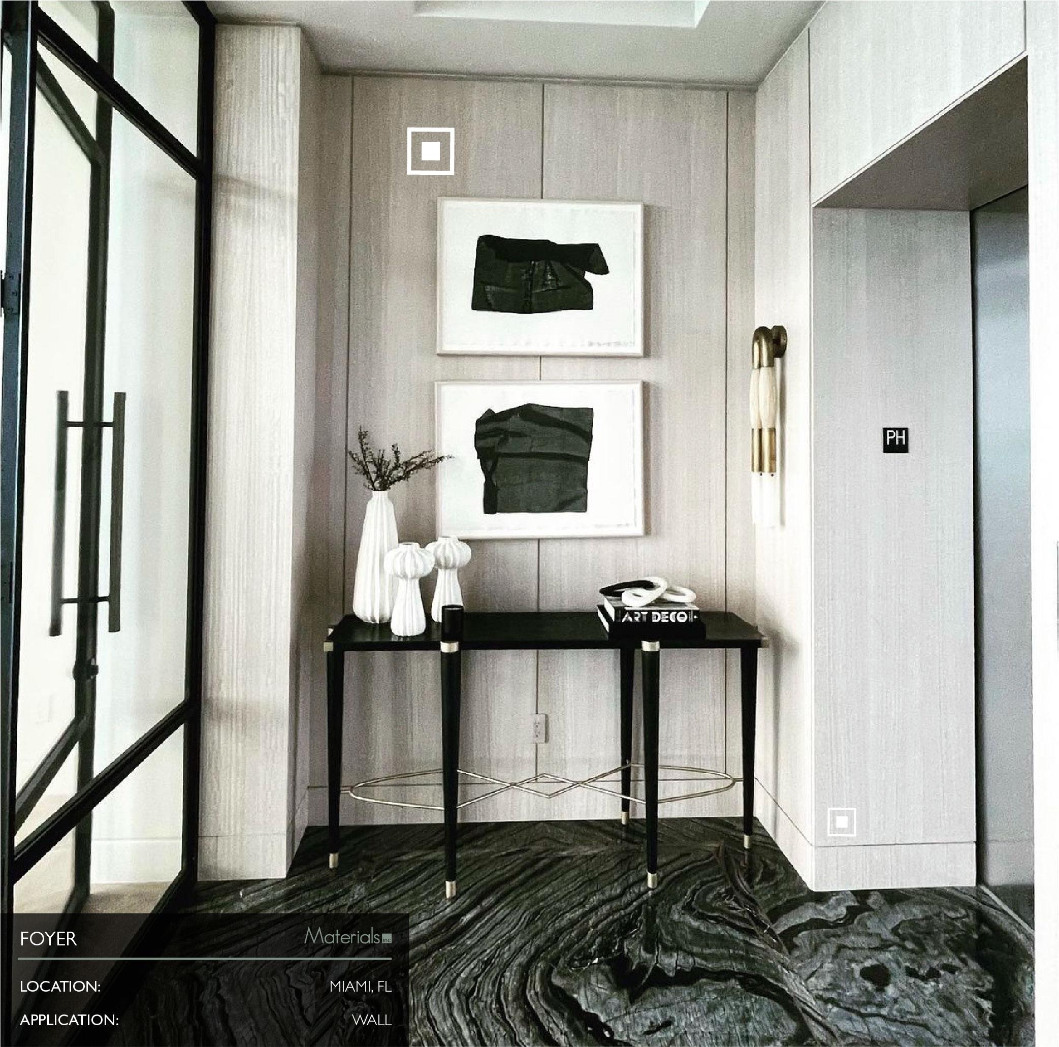 Dye-A-Log wood veneer wall paneling in a residential foyer with framed artwork and a console table