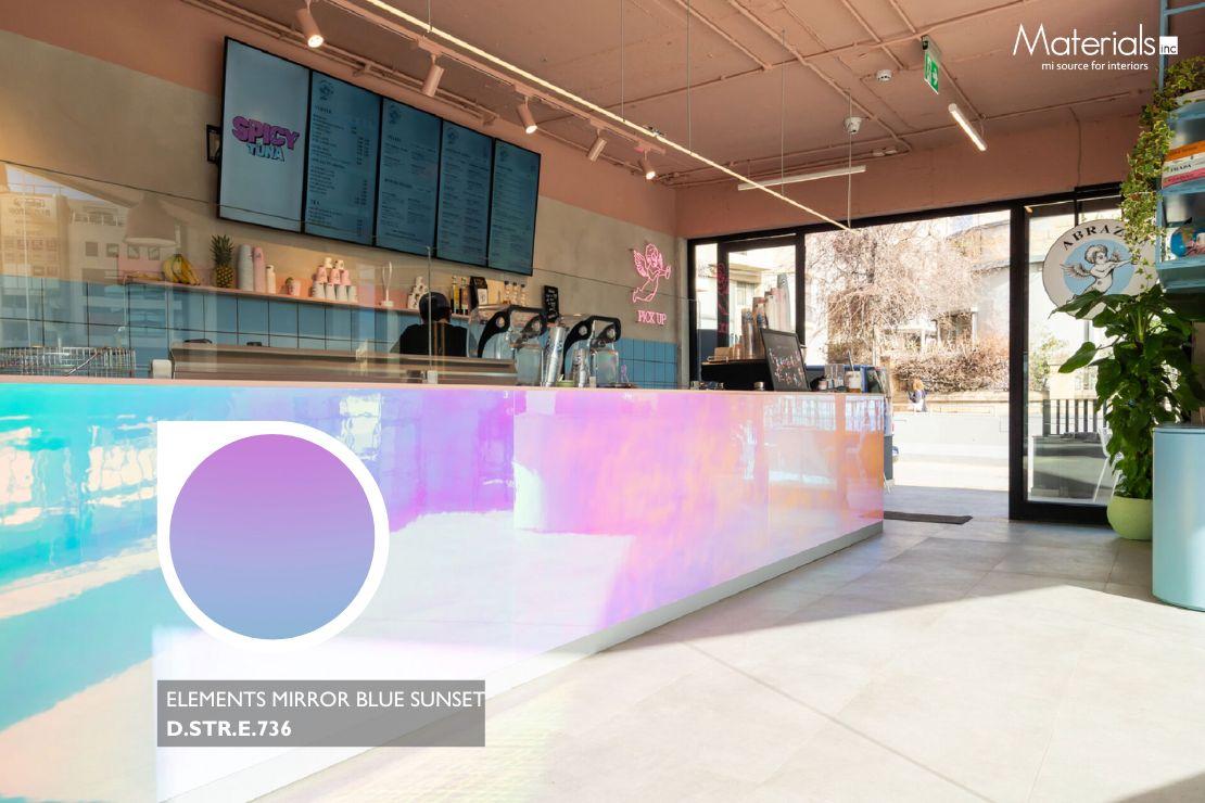Elements Mirror Blue Sunset iridescent panel cladding a café counter facade