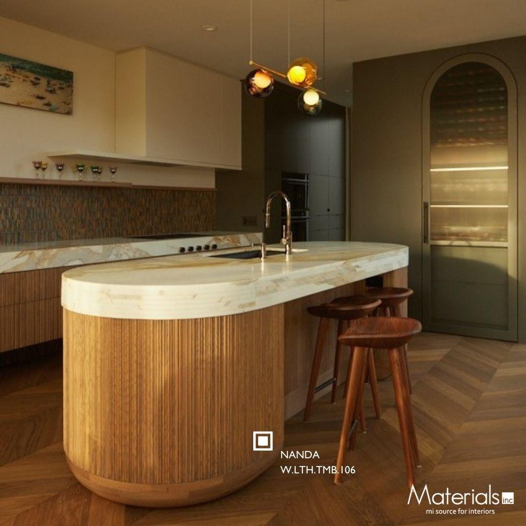 Tambora Nanda milled wood panel on a curved kitchen island base
