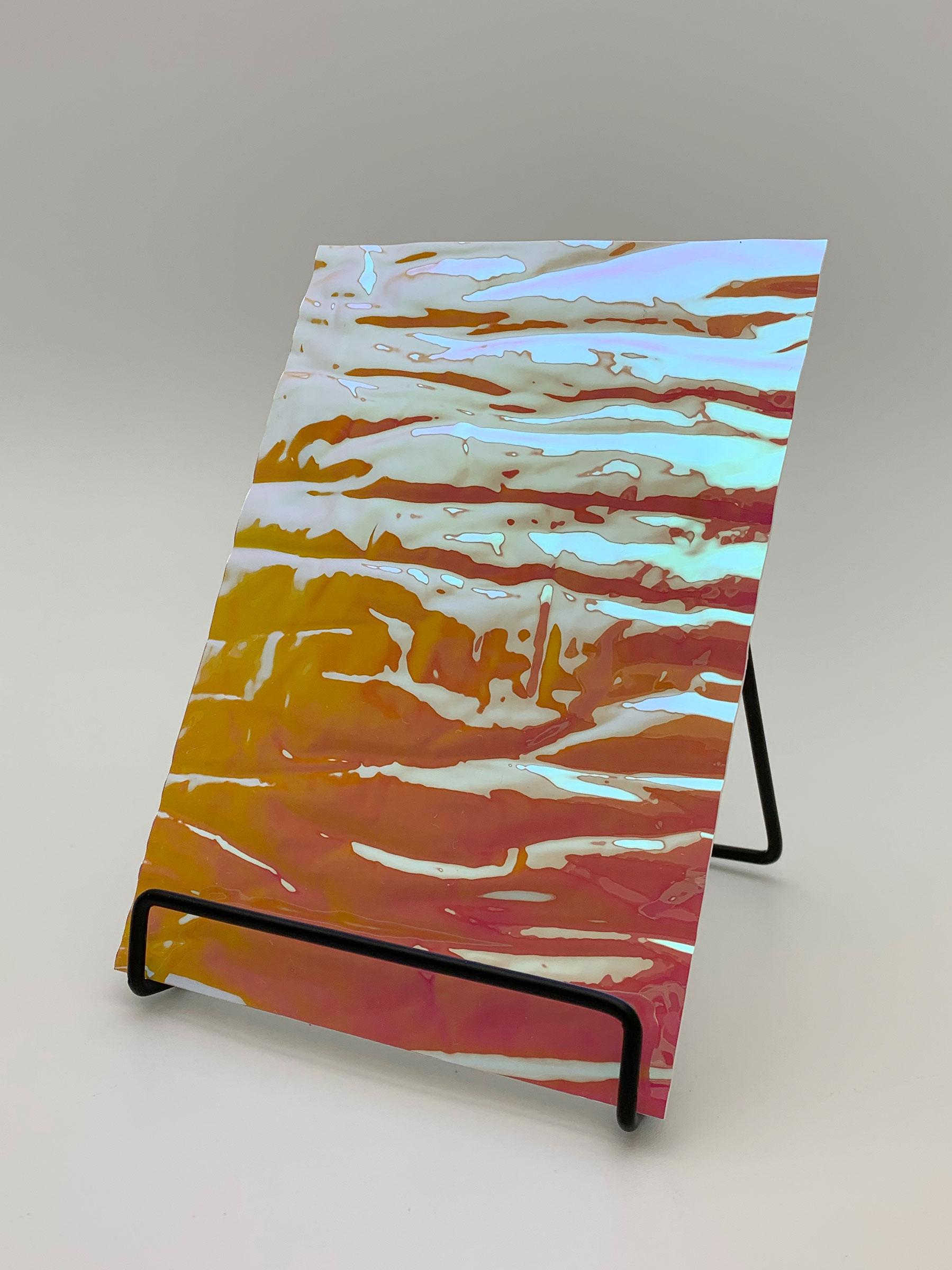 Elements Texture Pink Sunset Distortion real material sample - standing panel with a wavy, colour-shifting silver-to-amber and pink mirror surface