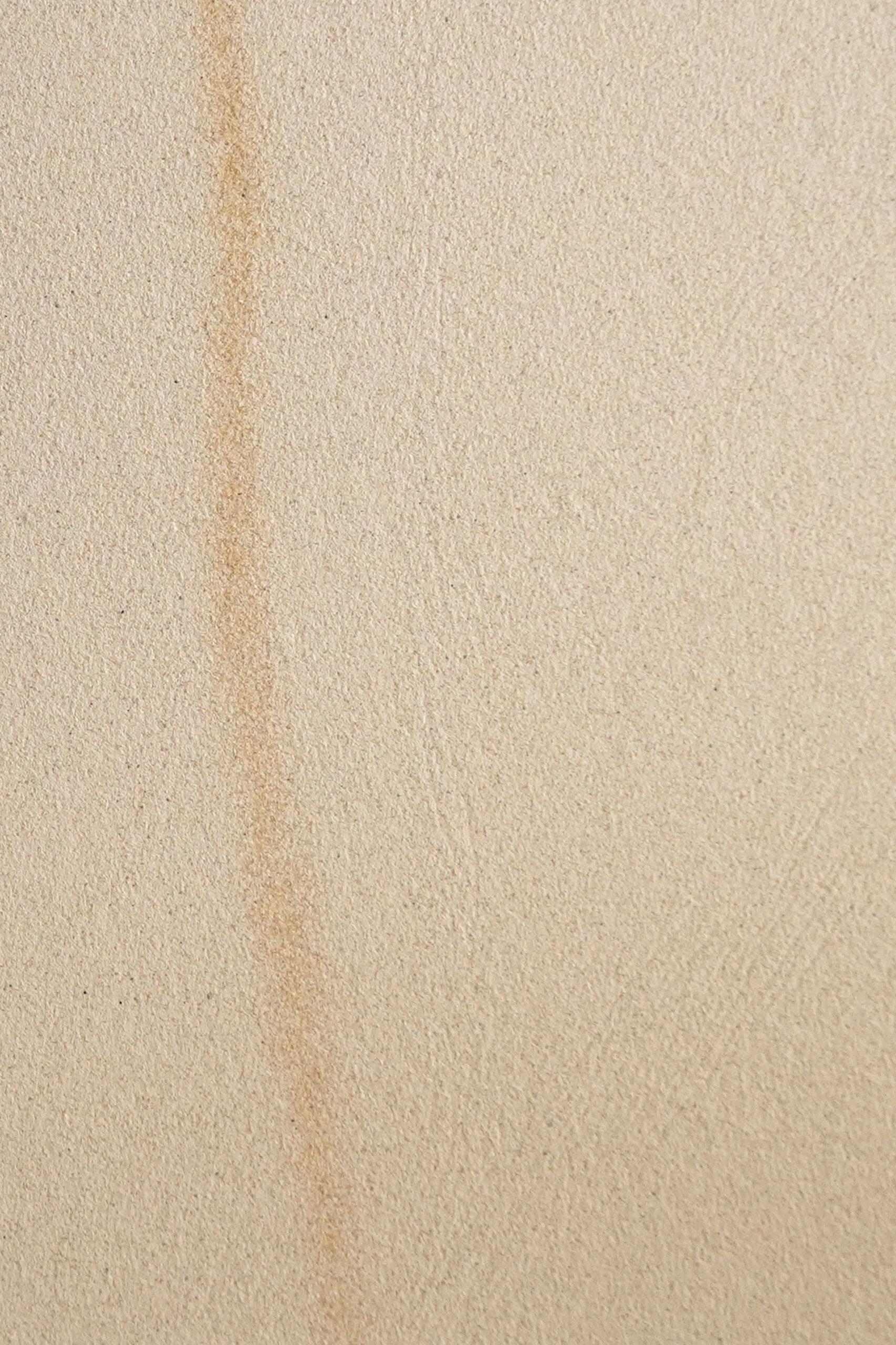 Aria Sand Beige real material sample - warm sand-beige concrete with soft mineral veining