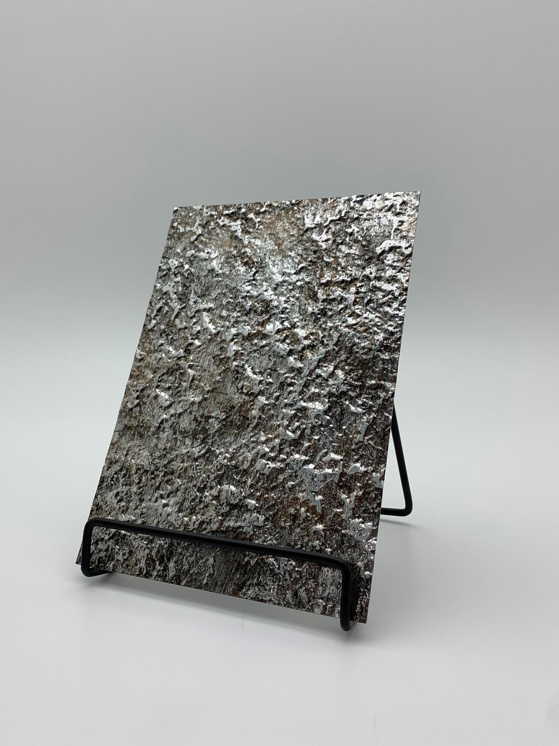 Elements Texture Silver Lava real material sample - a rough, molten-rock relief in silver