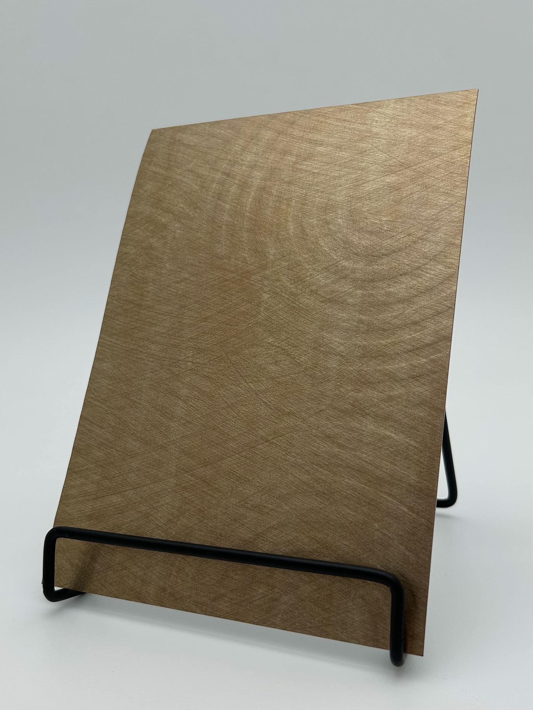 Elements Textile Swell Antique Gold real material sample - an antique-gold weave with broad concentric ripples