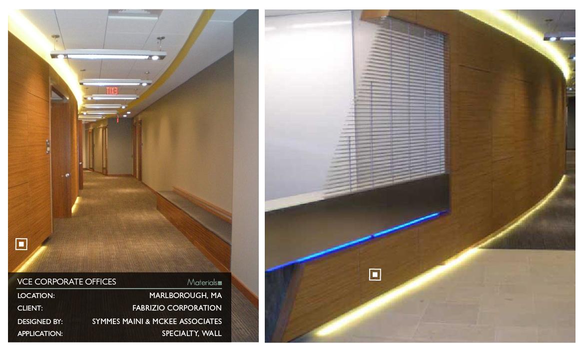 Prensa embossed wood panel cladding a curved hallway wall with cove lighting at VCE Corporate Offices