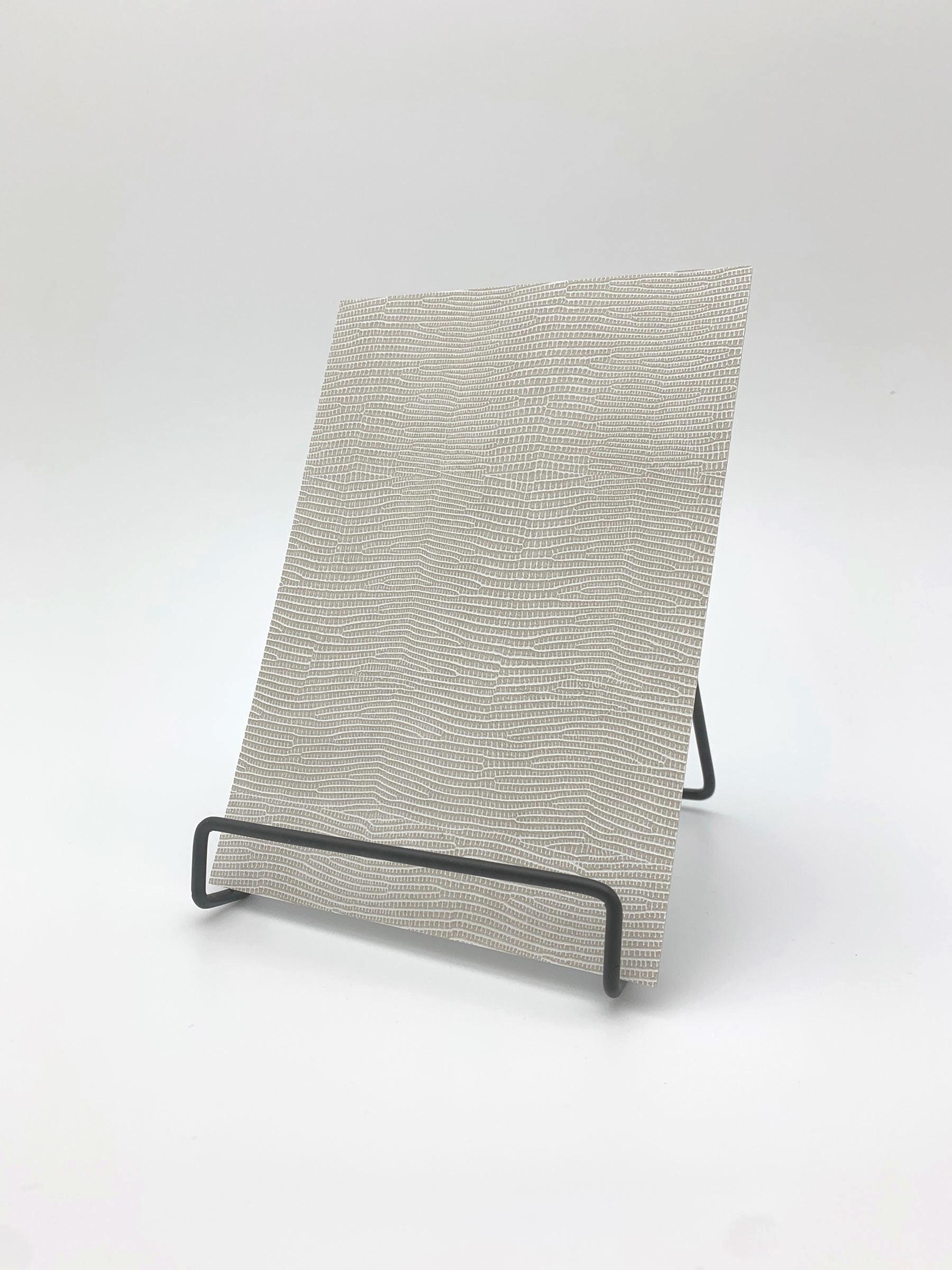 Elements White Luxe Leather real material sample - a fine reptile-scale leather grain in off-white
