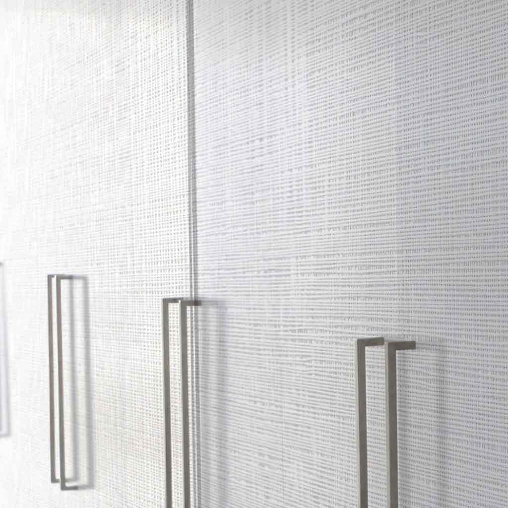 Prensa woven-texture white embossed wood panel closet doors with slim vertical pulls