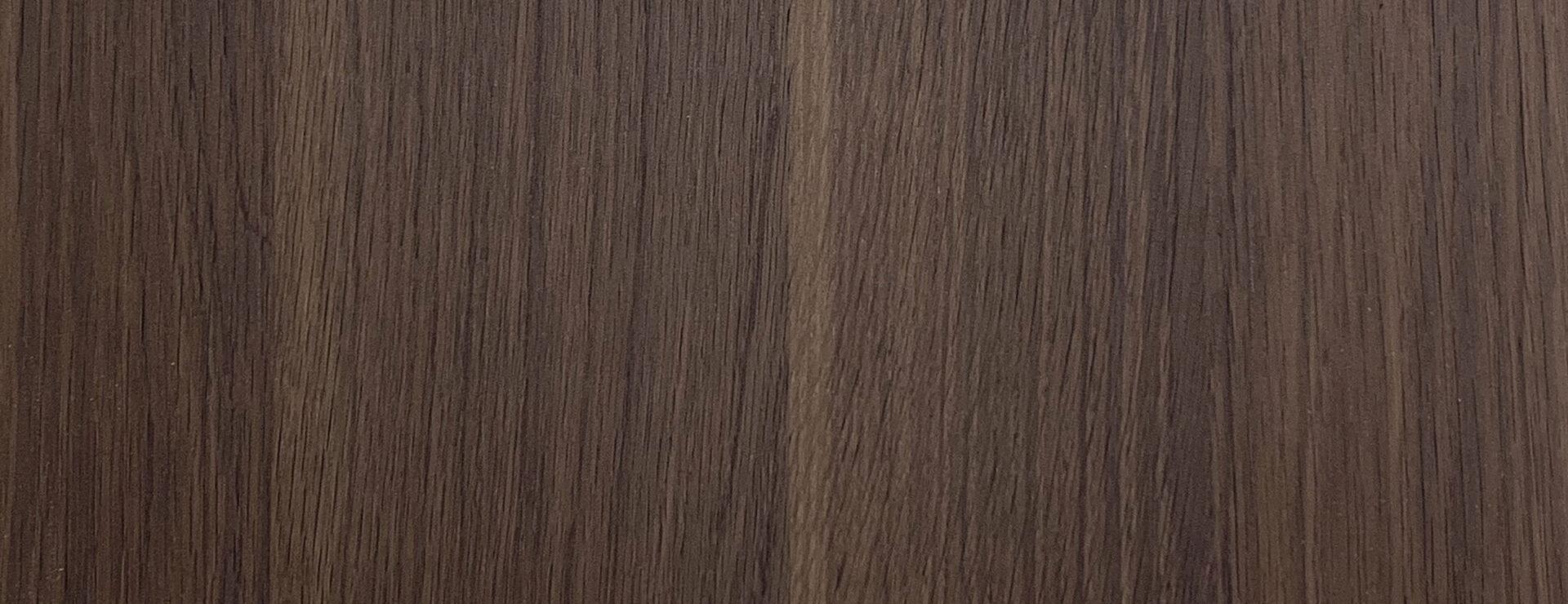 Elements Dark Walnut real material sample - natural matte wood grain laminate