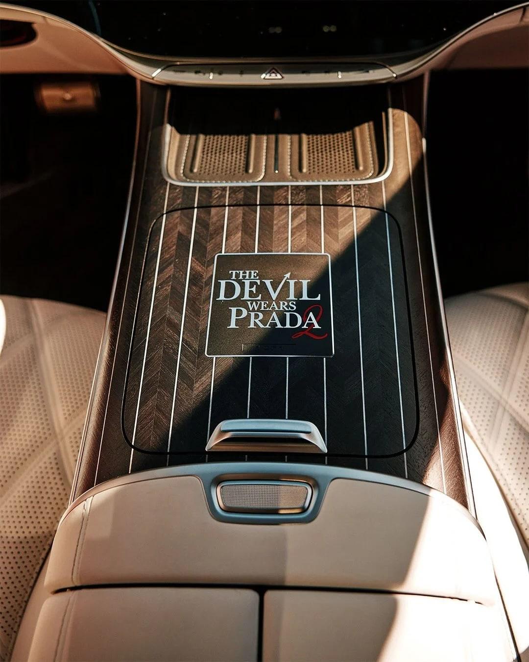 Maybach rear center console in Koncepts walnut chevron veneer with metal stripe inlay and The Devil Wears Prada logo panel
