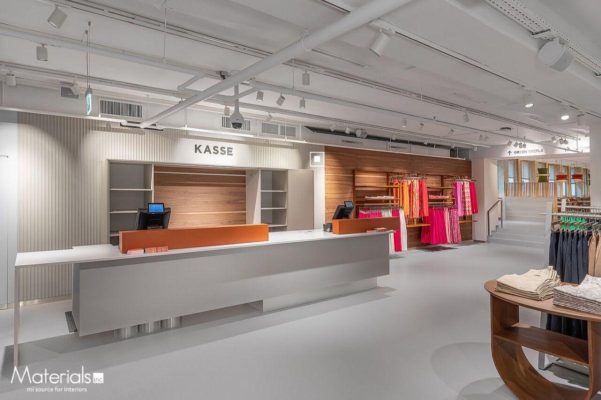 Aria Fluted concrete panel cladding a retail checkout counter and display wall at a Green Beetle store