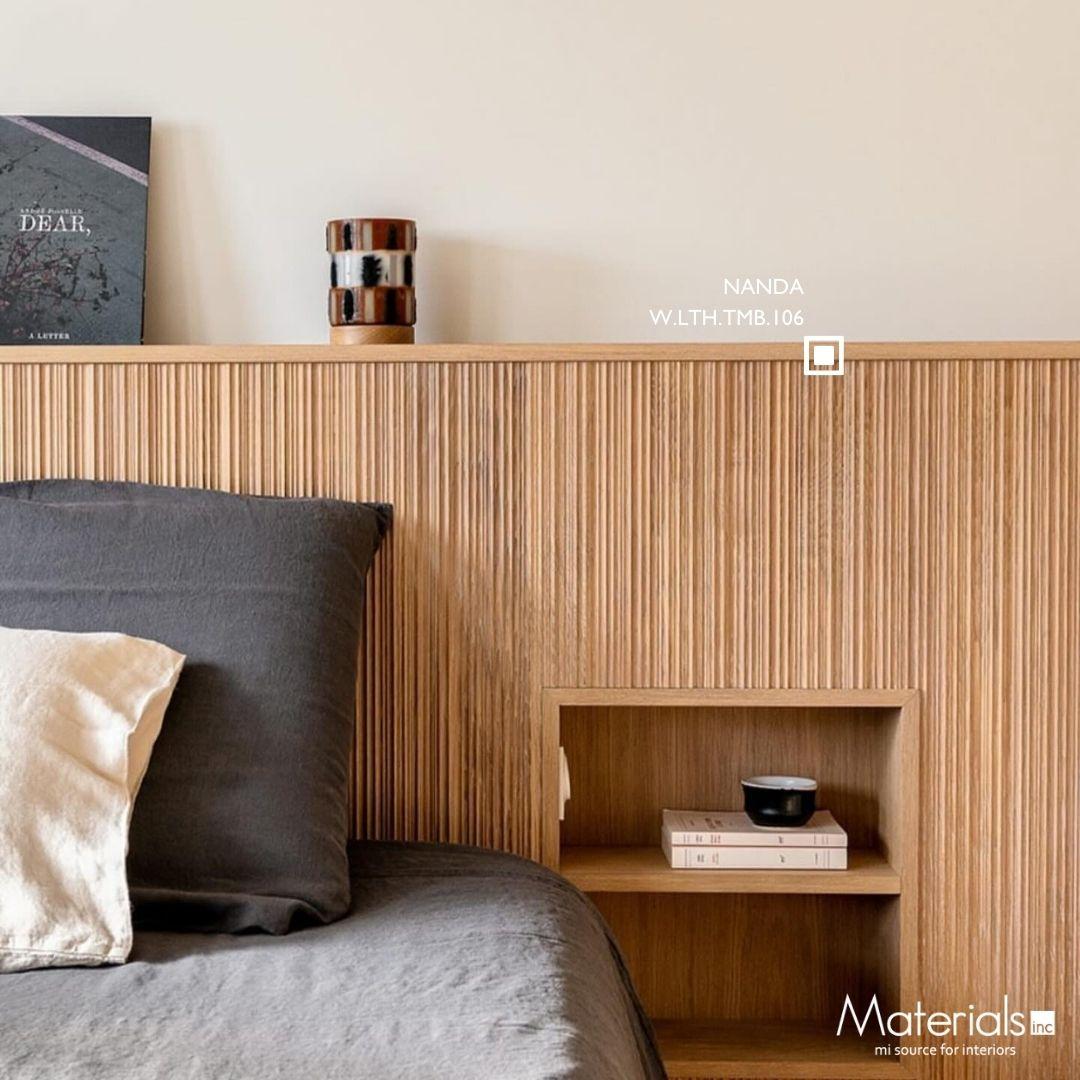 Tambora Nanda milled wood panel headboard with grey and cream linens and a built-in nightstand nook