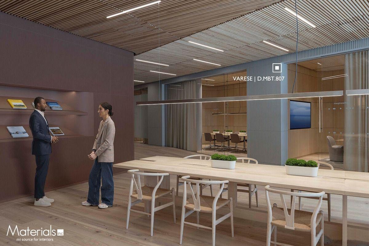 Aria Fluted Varese concrete panel cladding a reception wall with a magazine display and glass-walled meeting rooms